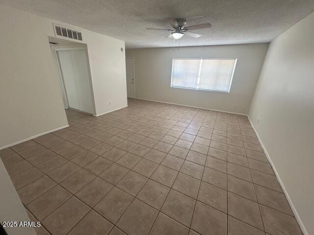 4625 W Thomas Rd Unit 48, Phoenix, AZ 85031 - empty room featuring tile patterned floors, a ceiling fan, and a textured ceiling