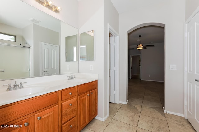 2475 E Vermont Dr, Gilbert, AZ 85295 - full bathroom with ceiling fan, double vanity, baseboards, and tile patterned flooring