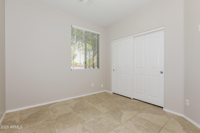 2475 E Vermont Dr, Gilbert, AZ 85295 - unfurnished bedroom with a closet and baseboards