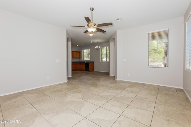 2475 E Vermont Dr, Gilbert, AZ 85295 - unfurnished room with light tile patterned flooring, ceiling fan, baseboards, and a chandelier