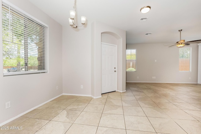 2475 E Vermont Dr, Gilbert, AZ 85295 - empty room featuring light tile patterned flooring, a chandelier, ceiling fan, and baseboards