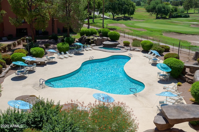 view of swimming pool featuring a patio