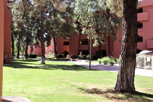 view of home's community featuring a yard