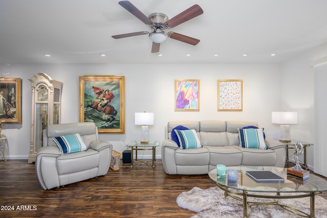 living room featuring dark hardwood / wood-style floors and ceiling fan