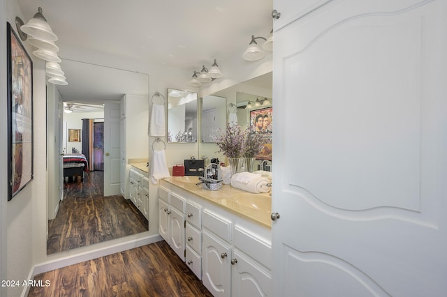 bathroom featuring vanity, hardwood / wood-style floors, and ceiling fan