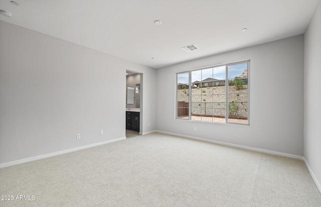 13512 W Copperleaf Ln, Peoria, AZ 85383 - spare room featuring light carpet and baseboards