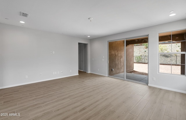 13512 W Copperleaf Ln, Peoria, AZ 85383 - empty room with light wood-style flooring and recessed lighting