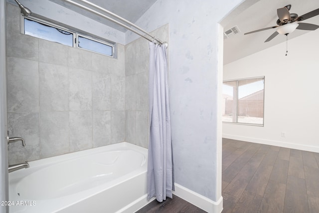 bathroom featuring plenty of natural light, wood-type flooring, and lofted ceiling