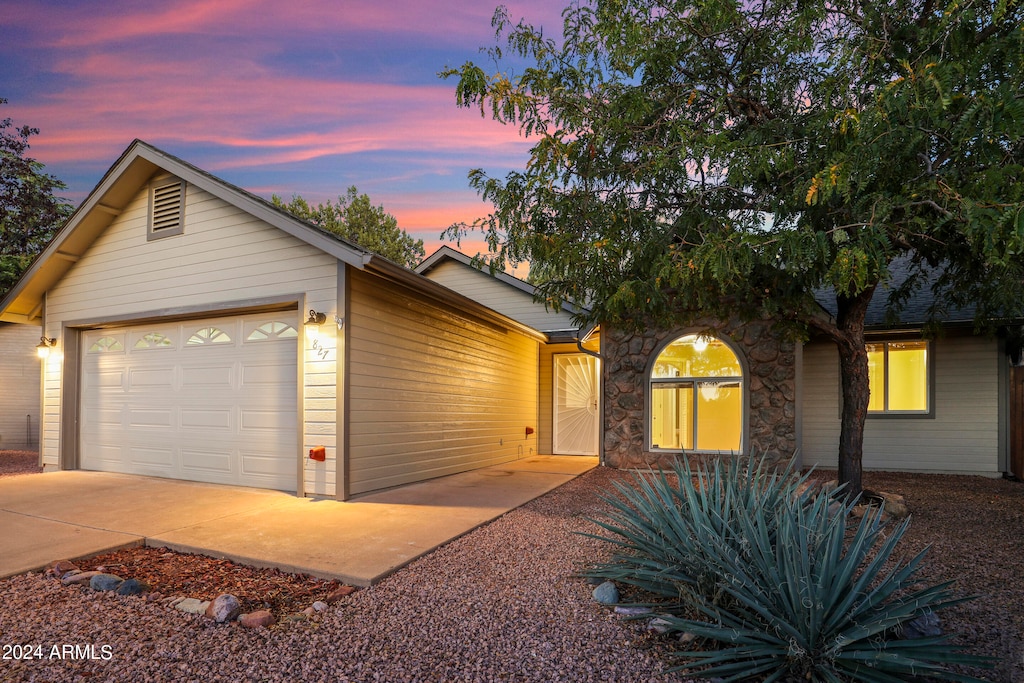 view of front of property with a garage