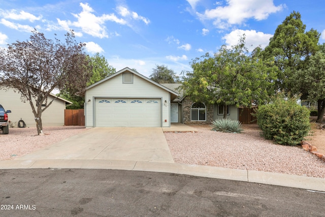 single story home with a garage