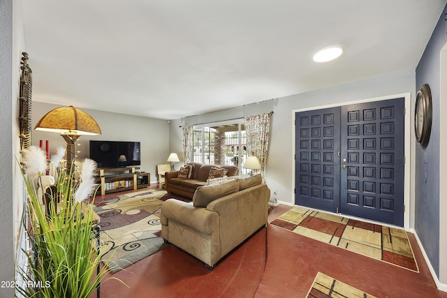 living room featuring baseboards