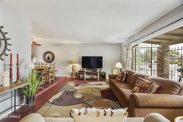 living area featuring baseboards
