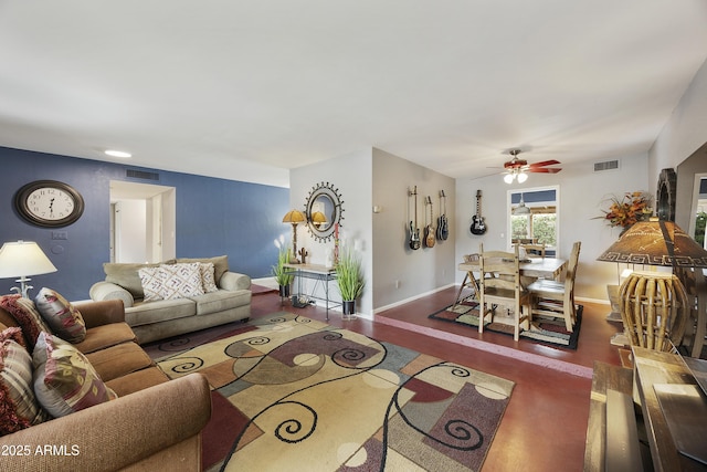 living room featuring baseboards, ceiling fan, visible vents, and wood finished floors