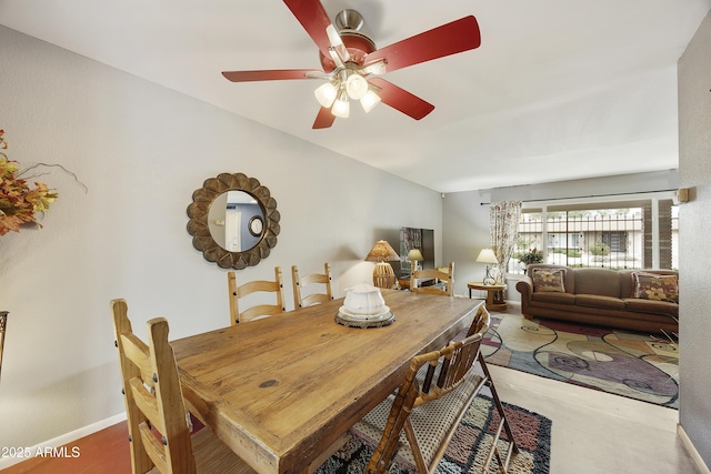 dining room with baseboards and a ceiling fan