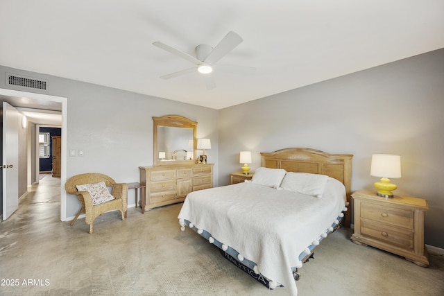 bedroom featuring ceiling fan, visible vents, and light carpet