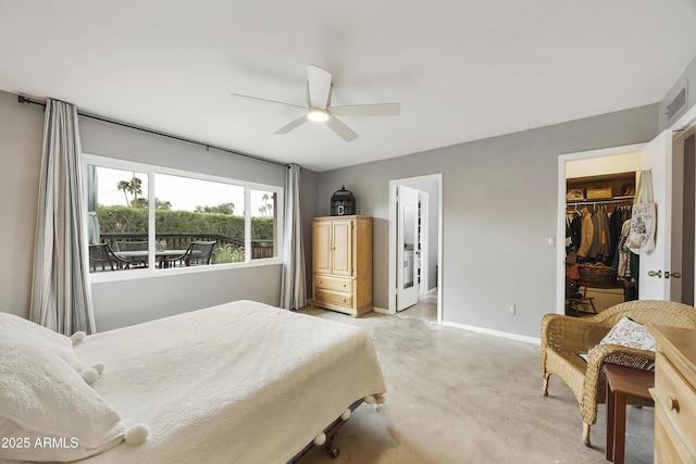 bedroom with a spacious closet, baseboards, visible vents, a ceiling fan, and a closet