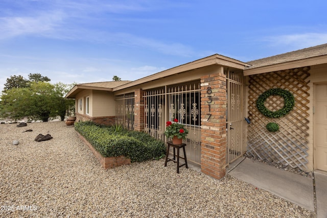 view of property exterior featuring brick siding