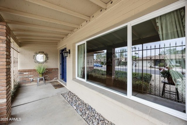 property entrance with brick siding