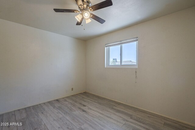 5657 E Dallas St, Mesa, AZ 85205 - unfurnished room with light wood finished floors, a ceiling fan, and baseboards