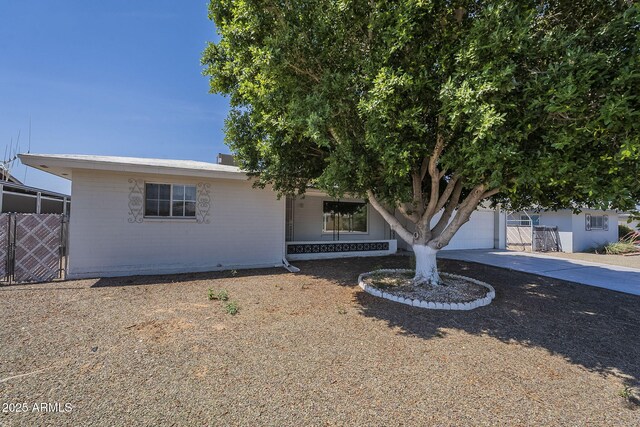 5657 E Dallas St, Mesa, AZ 85205 - view of front of home featuring concrete driveway and an attached garage