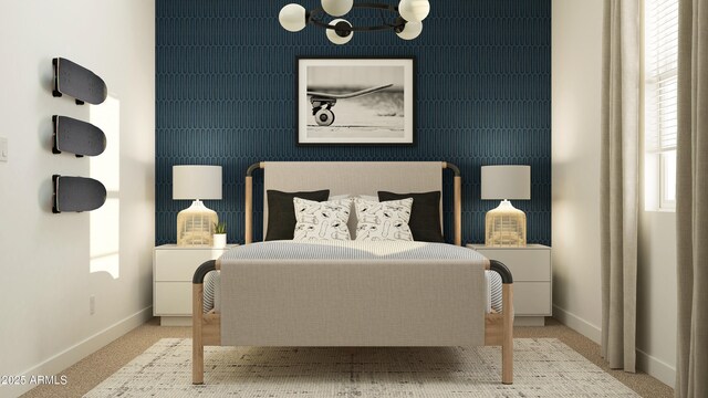 carpeted bedroom with baseboards and a notable chandelier