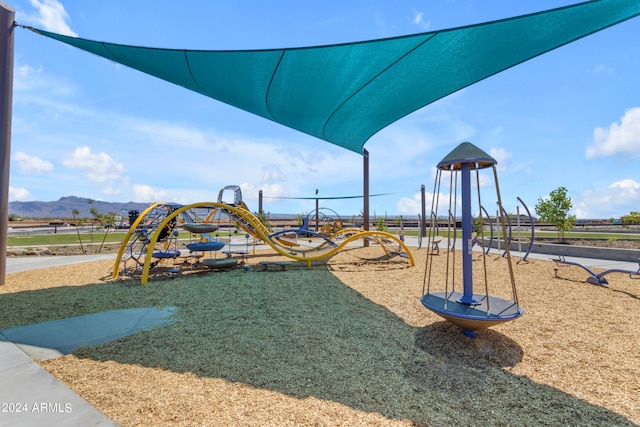 community play area featuring a mountain view