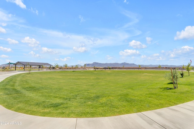 view of community featuring a yard, a gazebo, and a mountain view
