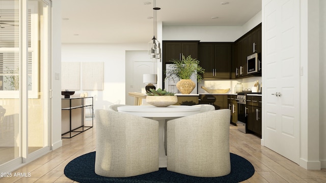 dining room with light wood-style flooring