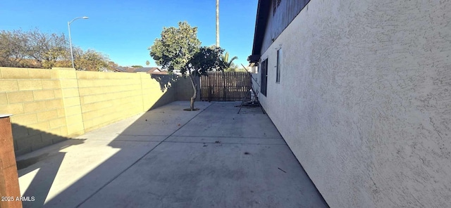 view of property exterior with a patio area