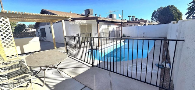 view of swimming pool featuring a patio area and central AC