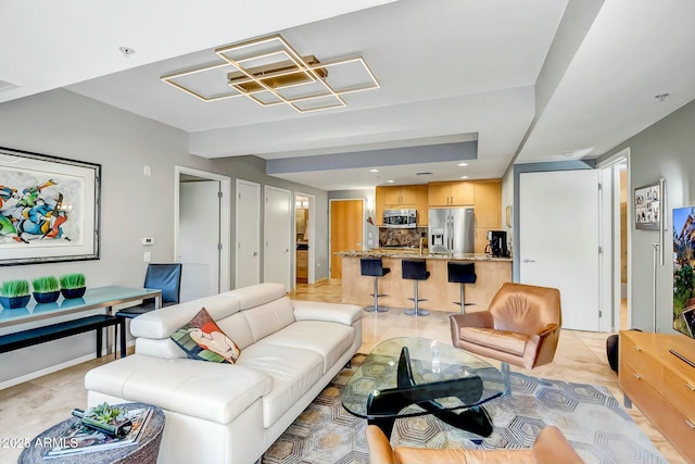 living room with an inviting chandelier