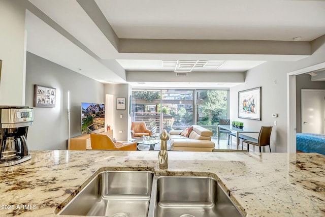 kitchen featuring light stone counters