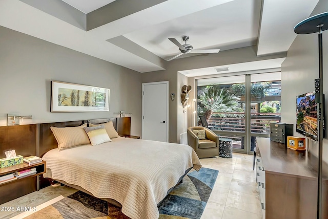 tiled bedroom featuring ceiling fan