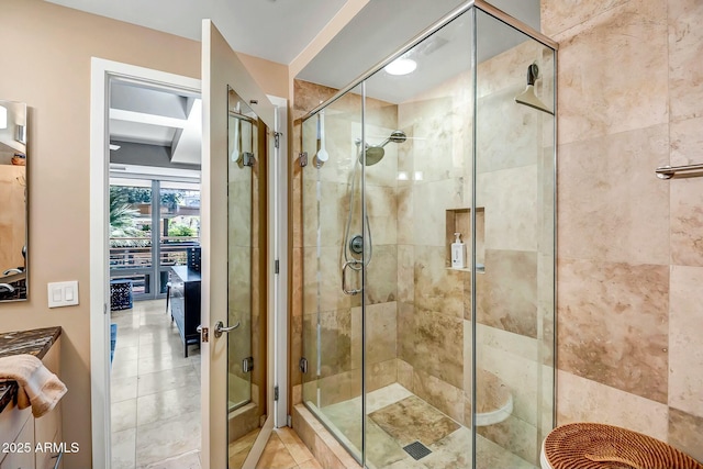 bathroom with tile patterned floors and walk in shower