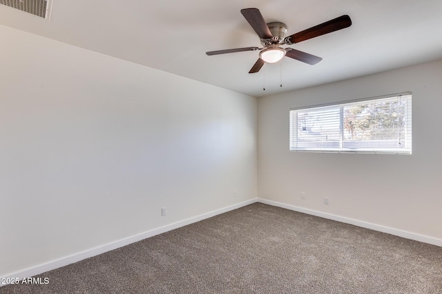 carpeted empty room featuring ceiling fan