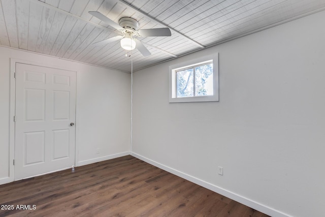 spare room with ceiling fan and dark hardwood / wood-style floors