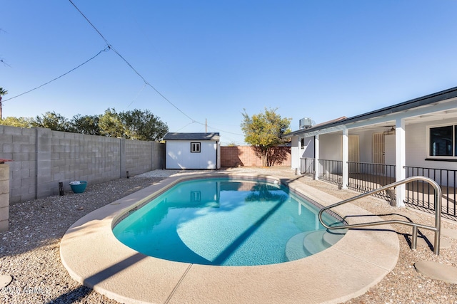 view of pool with a storage unit