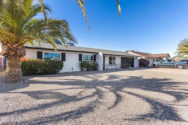 ranch-style house featuring a garage