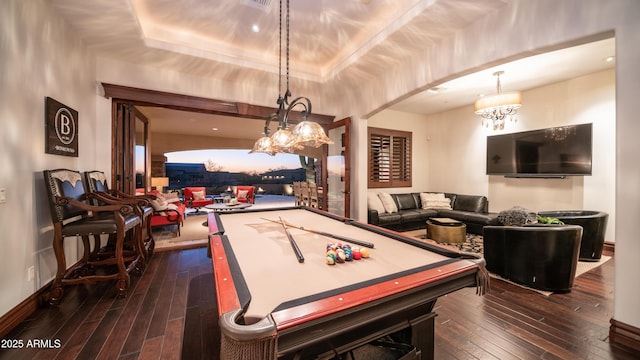 recreation room featuring dark wood-type flooring, pool table, and a tray ceiling