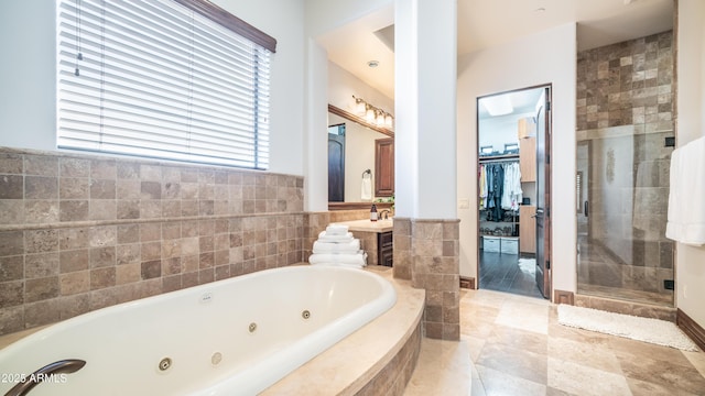 bathroom featuring shower with separate bathtub