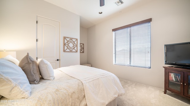 carpeted bedroom featuring ceiling fan