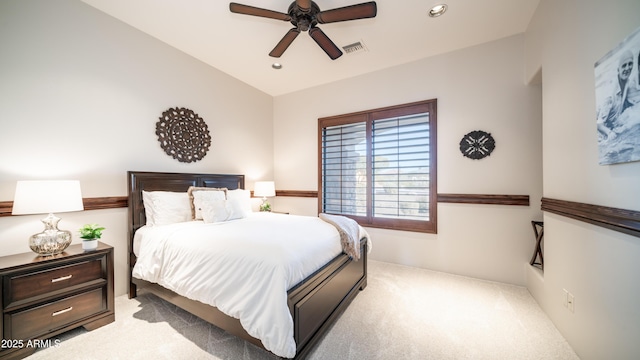 bedroom with ceiling fan and light colored carpet