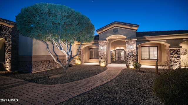 mediterranean / spanish-style home featuring french doors