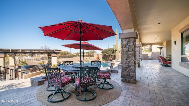 view of patio featuring area for grilling and a pergola