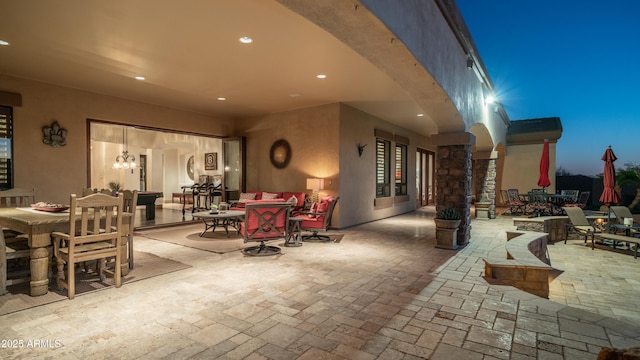 view of patio terrace at dusk