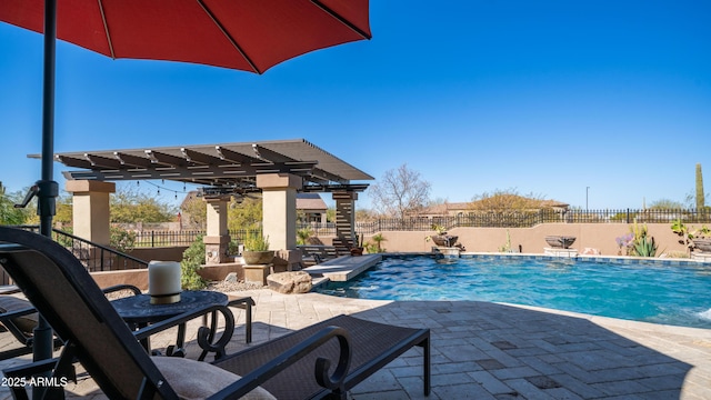 view of swimming pool featuring a patio and a pergola