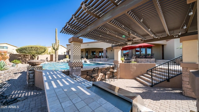 view of patio / terrace with a fenced in pool, pool water feature, and a pergola