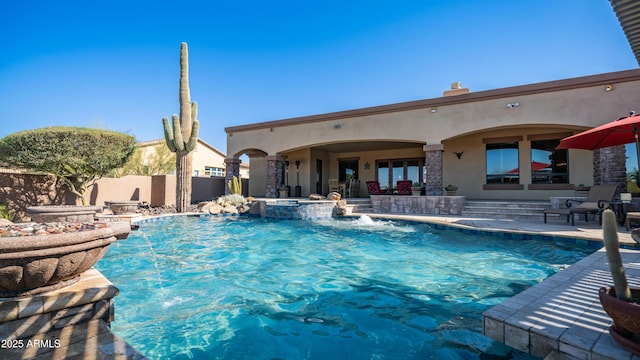 view of swimming pool featuring a patio and pool water feature