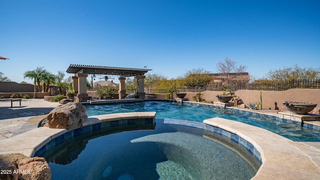 view of pool featuring a pergola, a patio area, and an in ground hot tub