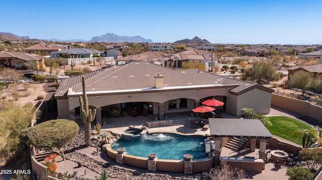 view of pool with a mountain view and a patio